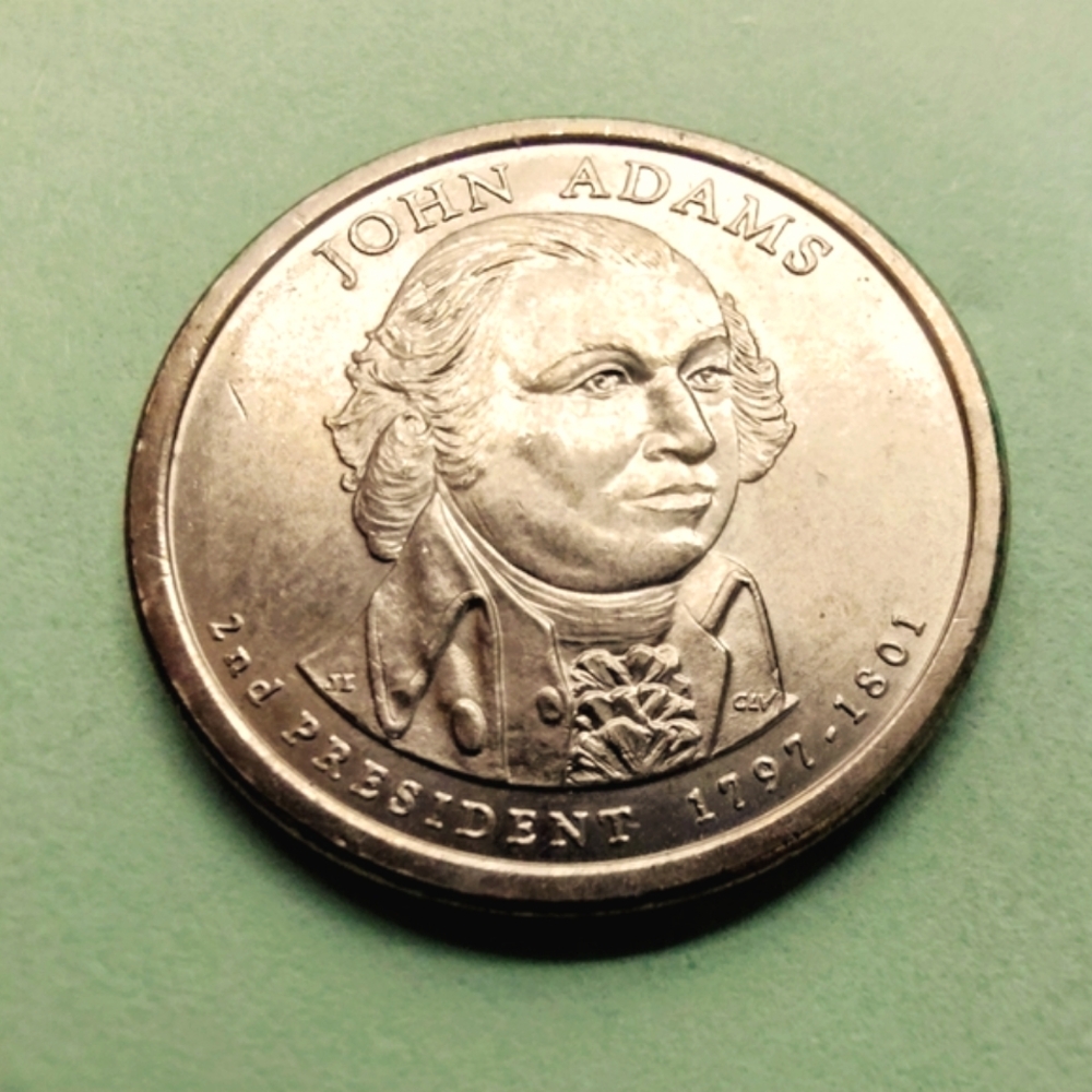 2007-P John Adams Presidential Gold Tone Coin In Good Circulated Condition.